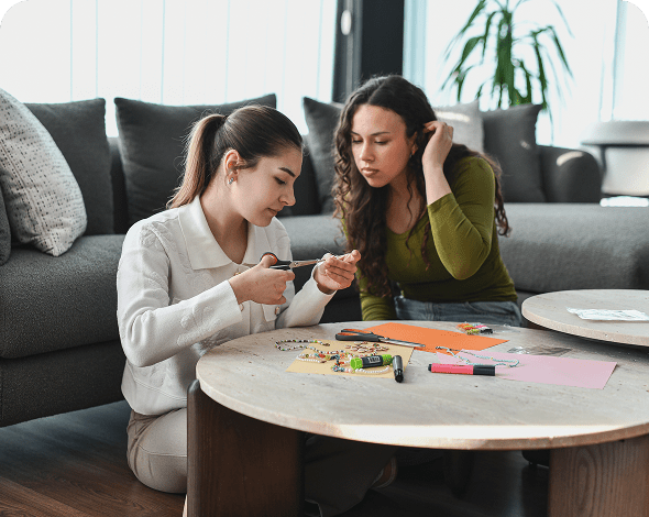 Two women engaged in crafts activity