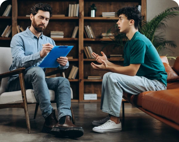 Man taking notes during therapy