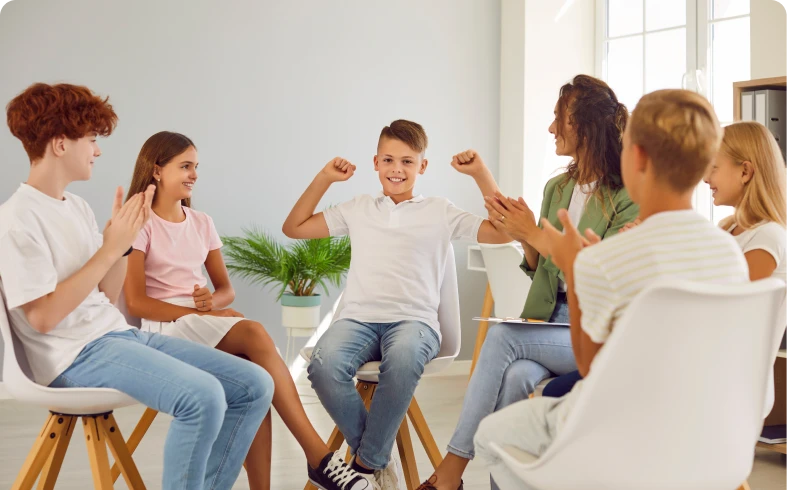 Children celebrating in a group discussion